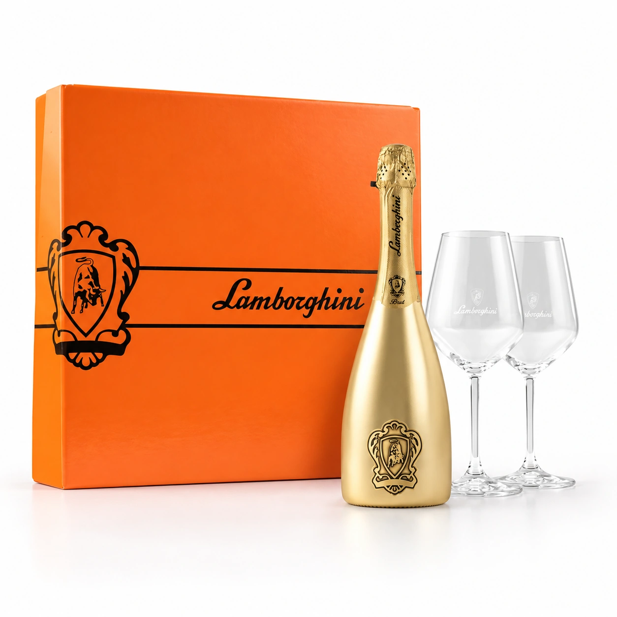 Coffret orange Lamborghini, bouteille dorée et deux verres sur fond blanc.